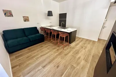 a living room with a couch and a table at Roma city center stay San Giovanni in Rome