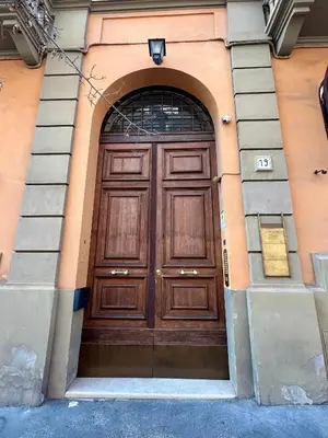 a large wooden door on the side of a building at Roma city center stay San Giovanni in Rome