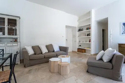 a living room with a couch and a table at Pgrhome Civinini in Rome