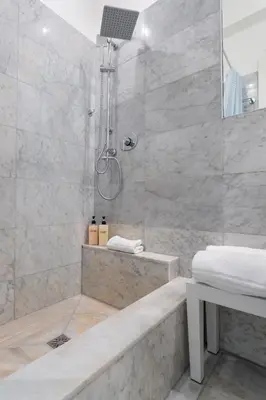 a bathroom with a shower with a tub and a sink at Pgrhome Civinini in Rome