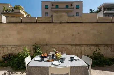 a table with food on it in front of a wall at Pgrhome Civinini in Rome