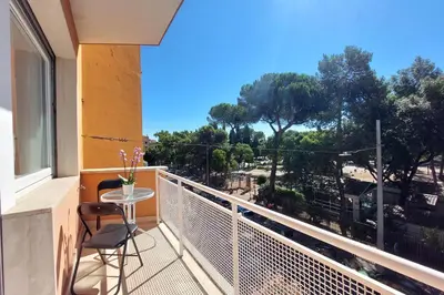 a balcony with a table and a view of trees at YCH-Elegante appartamento vicino Villa Ada in Rome