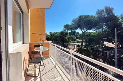 a balcony with a table and chairs and a view at YCH-Elegante appartamento vicino Villa Ada in Rome