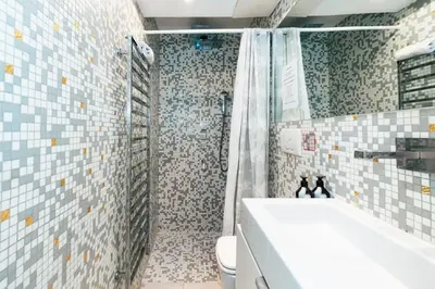 a bathroom with a shower and a tub and a toilet at Roma Suite Piazza Navona in Rome