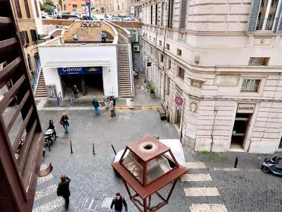 an overhead view of a city street with people walking at 600mt To Colosseum in Rome