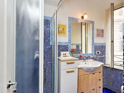 a bathroom with a sink and a shower at 600mt To Colosseum in Rome