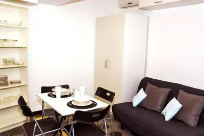 a living room with a couch and a table at Rome Center Attic Penthouse in Rome