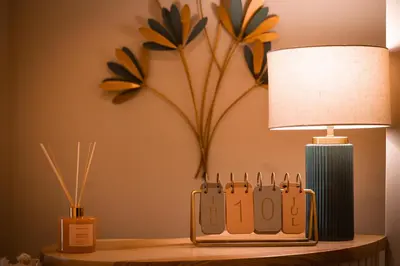 a lamp on a table next to a table with a lamp at Alma Guest House in Rome