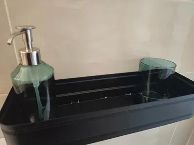 a black tray with a bottle and two glasses at the italians house in Roma San Lorenzo in Rome