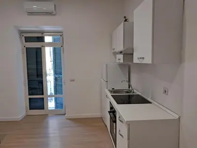 a white kitchen with a sink and a stove at Pigneto New collection 2 Casilina in Rome