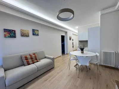 a living room with a couch and a table at Luxury Apartment Metro Cornelia in Rome