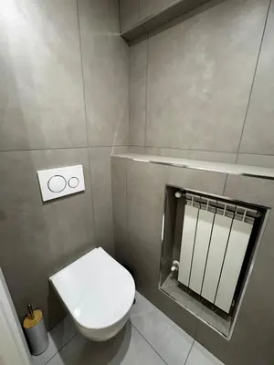 a small bathroom with a toilet and a mirror at The Roman Retreat - 2BDR Colosseum Monti district in Rome