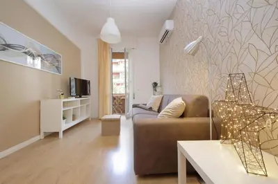 a living room with a couch and a table at Circo Massimo House by Luxury Getaways in Rome
