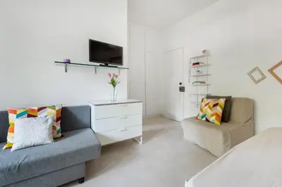 a living room with a couch and a tv at Aurelia vetus apartment Rome in Rome