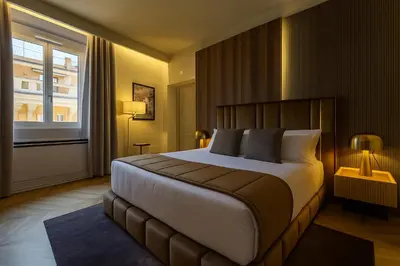a bedroom with a large bed and a window at Fontart Tritone in Rome