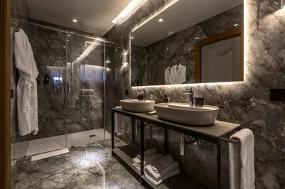 a bathroom with two sinks and a shower at Fontart Tritone in Rome