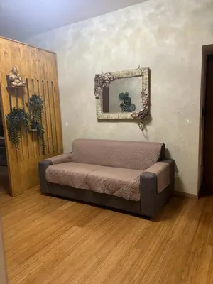 a room with a couch and a mirror on the wall at Locanda di Trastevere in Rome