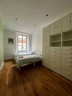 a bedroom with a bed and a window at Zaffiro FIUME charming apartment in Rome