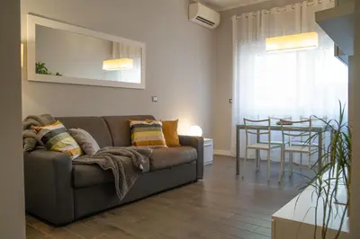 a living room with a couch and a table at I Love San Pietro in Rome
