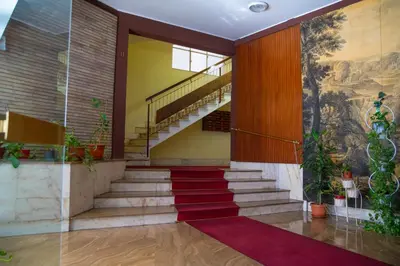 a staircase in a building with a painting on the wall at I Love San Pietro in Rome