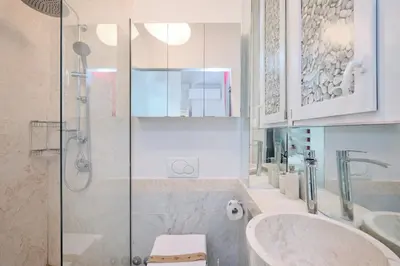 a bathroom with a shower and a sink and a toilet at Vatican Apartment 4 Bedrooms AC in Rome