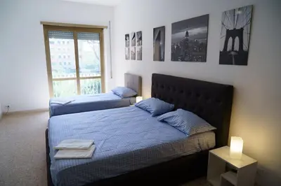 a bedroom with two beds and a window at Apartment16 in Rome