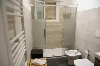 a bathroom with a shower and a toilet and a sink at Apartment16 in Rome