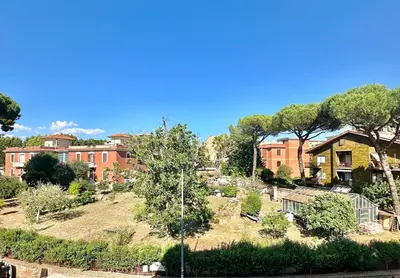 a view of a garden in front of a building at Wanderlust RHome - Scopri Roma e sogna il mondo! in Rome