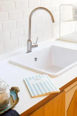 a kitchen counter with a white sink at Lovely apt in Rome! in Rome
