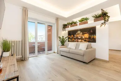 a living room with a couch and a table at Luxury Rooms near St Peter in Rome