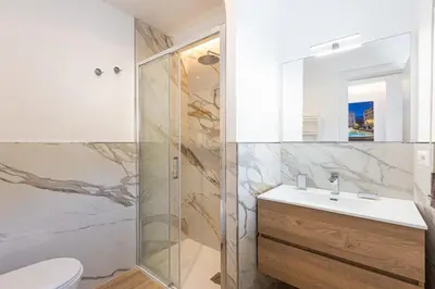 a bathroom with a shower and a sink and a toilet at Luxury Rooms near St Peter in Rome