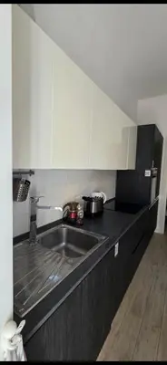 a kitchen with a sink and a counter top at Al pozzo di Garibaldi in Rome