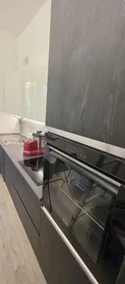 a kitchen with a stove top oven in a kitchen at Al pozzo di Garibaldi in Rome