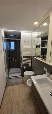 a bathroom with a shower and a toilet and a sink at Al pozzo di Garibaldi in Rome