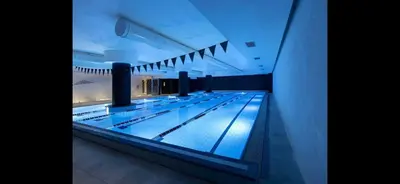 a swimming pool in a building with its lanes at Al pozzo di Garibaldi in Rome