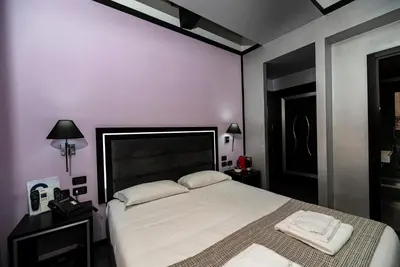 a bedroom with a large bed with two towels on it at Imperium Suite Navona in Rome