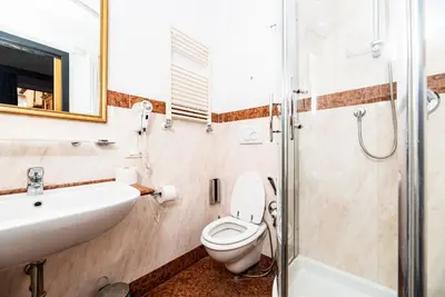 a bathroom with a toilet and a sink and a shower at Imperium Suite Navona in Rome