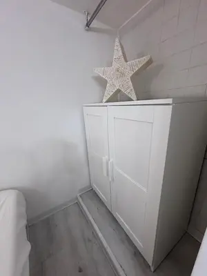 two stars on top of a white cabinet in a room at Golden Suite - un piccolo loft nel cuore di Roma in Rome