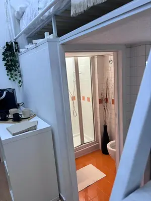 a small kitchen with a sink and a toilet at Golden Suite - un piccolo loft nel cuore di Roma in Rome