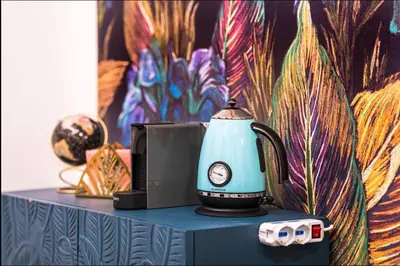 a tea kettle sitting on top of a table at Vatican City Deluxe - Suite con bagno privato - Vaticano a piedi in Rome