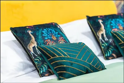 three pillows with giraffes on them on a bed at Vatican City Deluxe - Suite con bagno privato - Vaticano a piedi in Rome