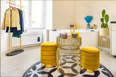 a living room with yellow stools and a table at Vatican City Deluxe - Suite con bagno privato - Vaticano a piedi in Rome