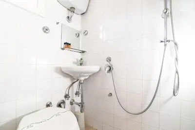 a bathroom with a shower and a sink at Navona studio with terrace Backpackers in Rome