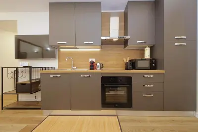 a kitchen with a sink and a stove at Holy Mary Lovely Apartment in Rome