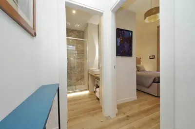 a hallway leading to a bedroom with a bed at Holy Mary Lovely Apartment in Rome