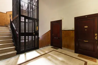 an empty room with two doors and stairs at Aras Luxury Flat in Rome