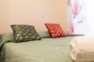 two pillows sitting on a bed in a room at Menghini Easy Flat in Rome