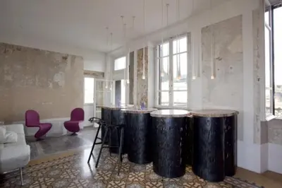 a living room with a row ofools in a room at 3000rome Di Parione in Rome