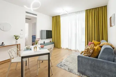 a living room with a couch and a table at La Saponeria - Roma Centro - Free Parking in Rome