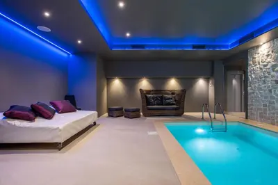 a bedroom with a bed and a swimming pool at Fortyfive Squared Hotel in Rome